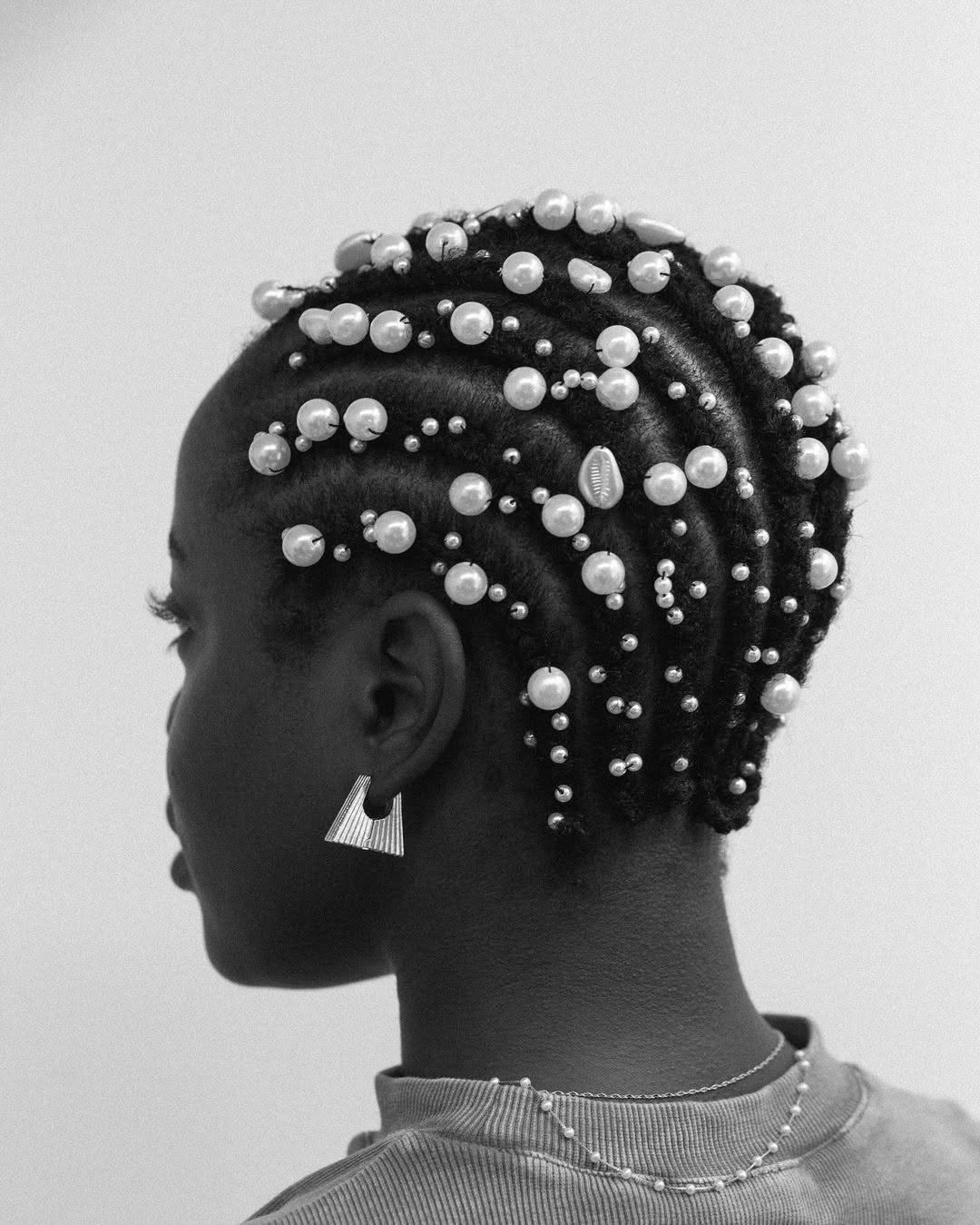 hairstyle ideas for black women 2027 Pearl Adorned Cornrows With A Sculptural Finish