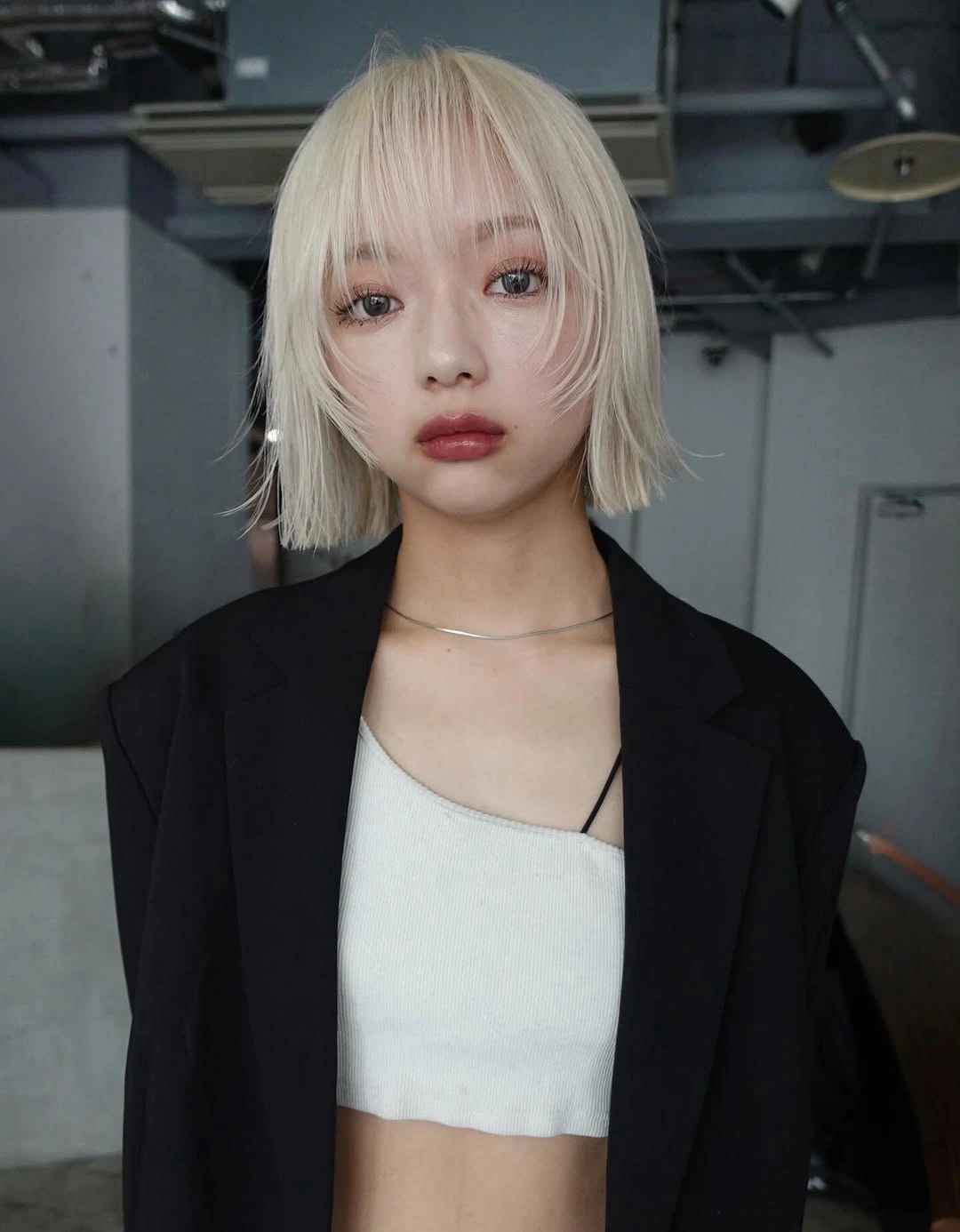 layered bob haircut Platinum Bob With Feathered Bangs