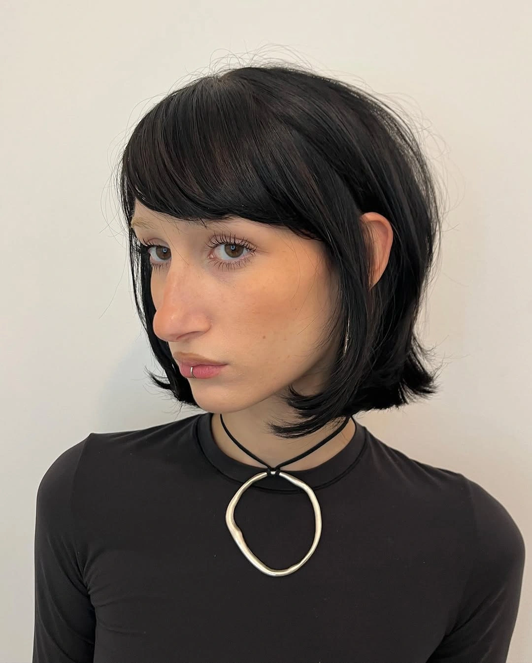 layered bob haircut Jet Black Bob With Side Swept Bangs