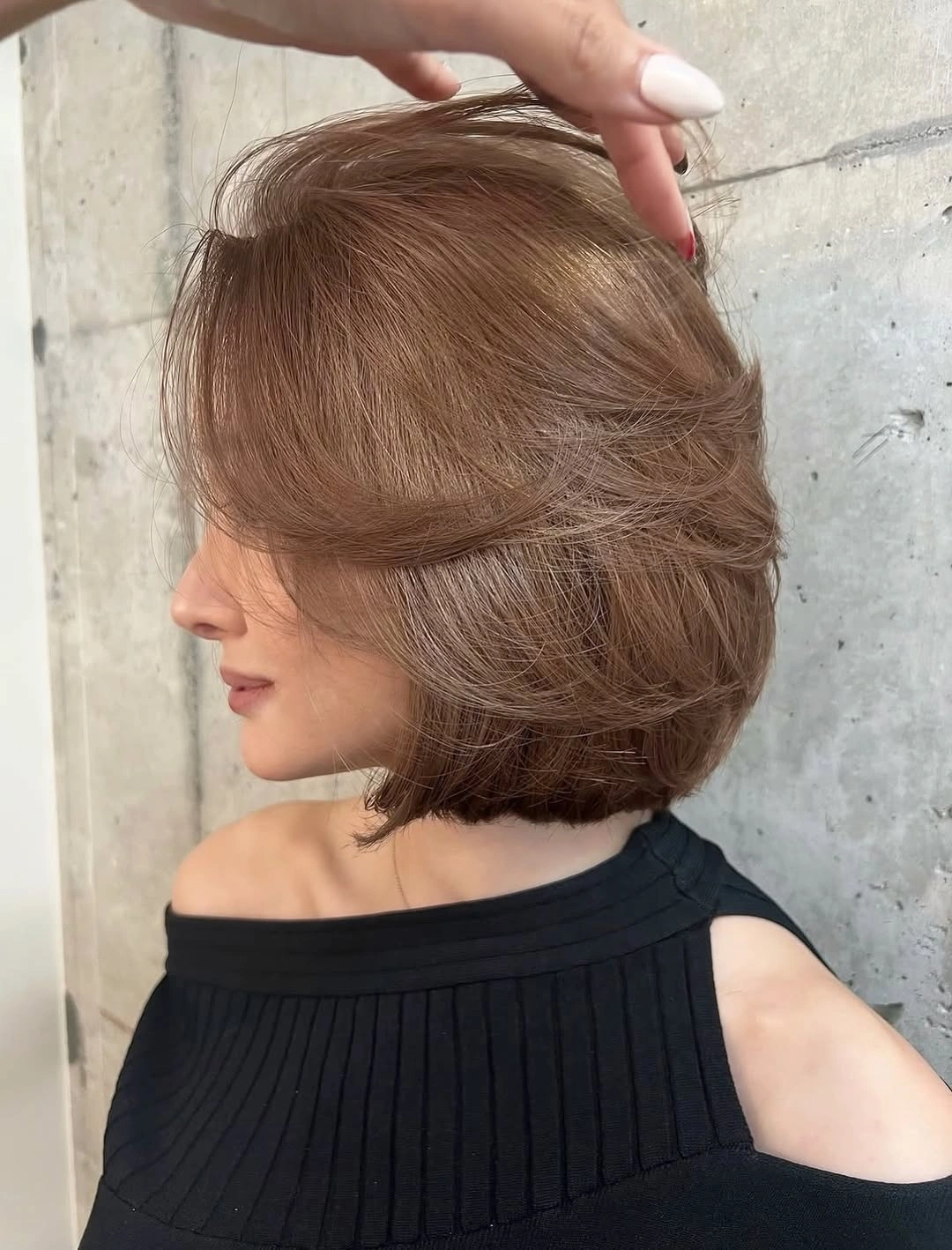 layered bob haircut Rounded Brunette Bob With Sweeping Layers