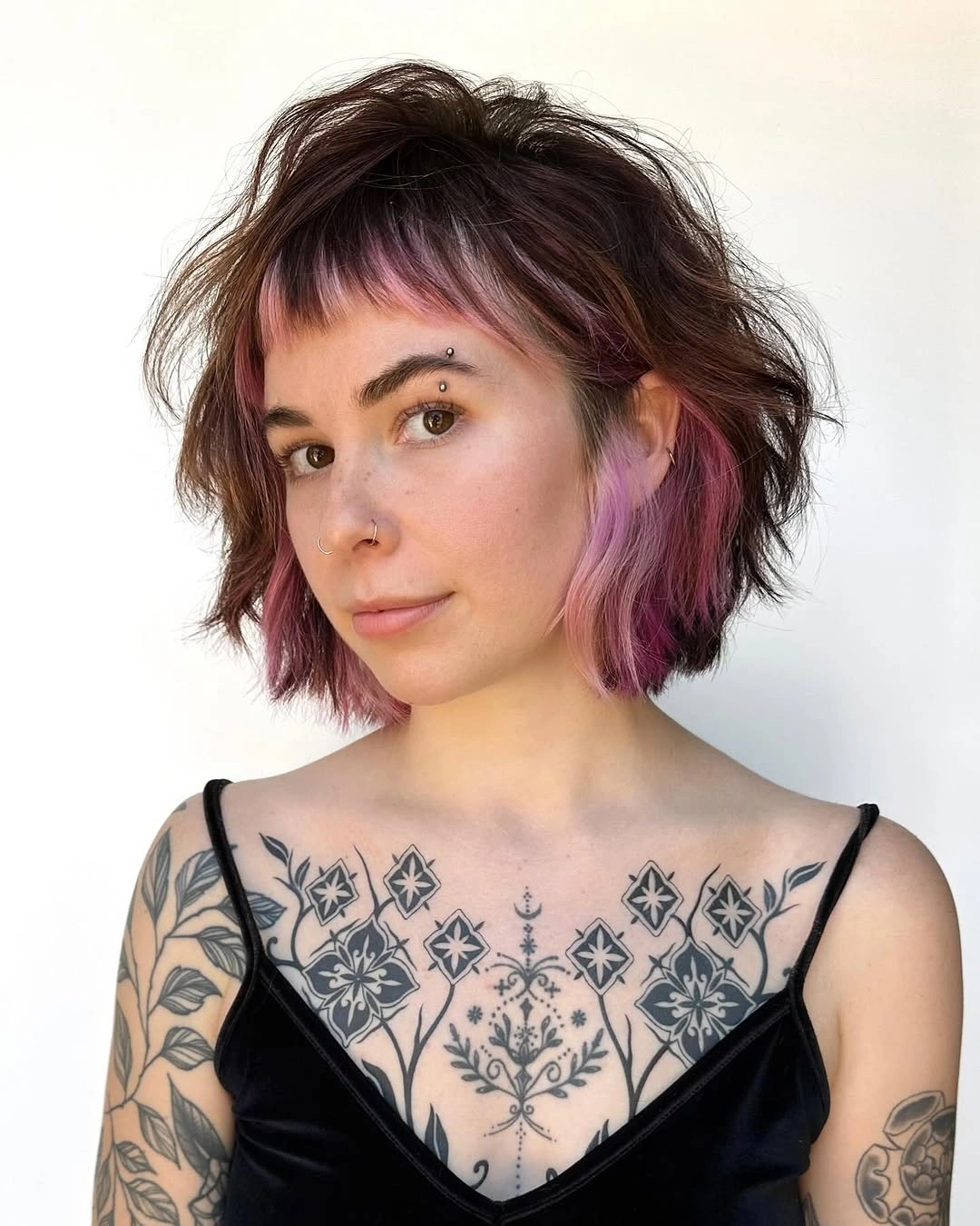 layered bob haircut Choppy Bob With Pink Peekaboo Layers
