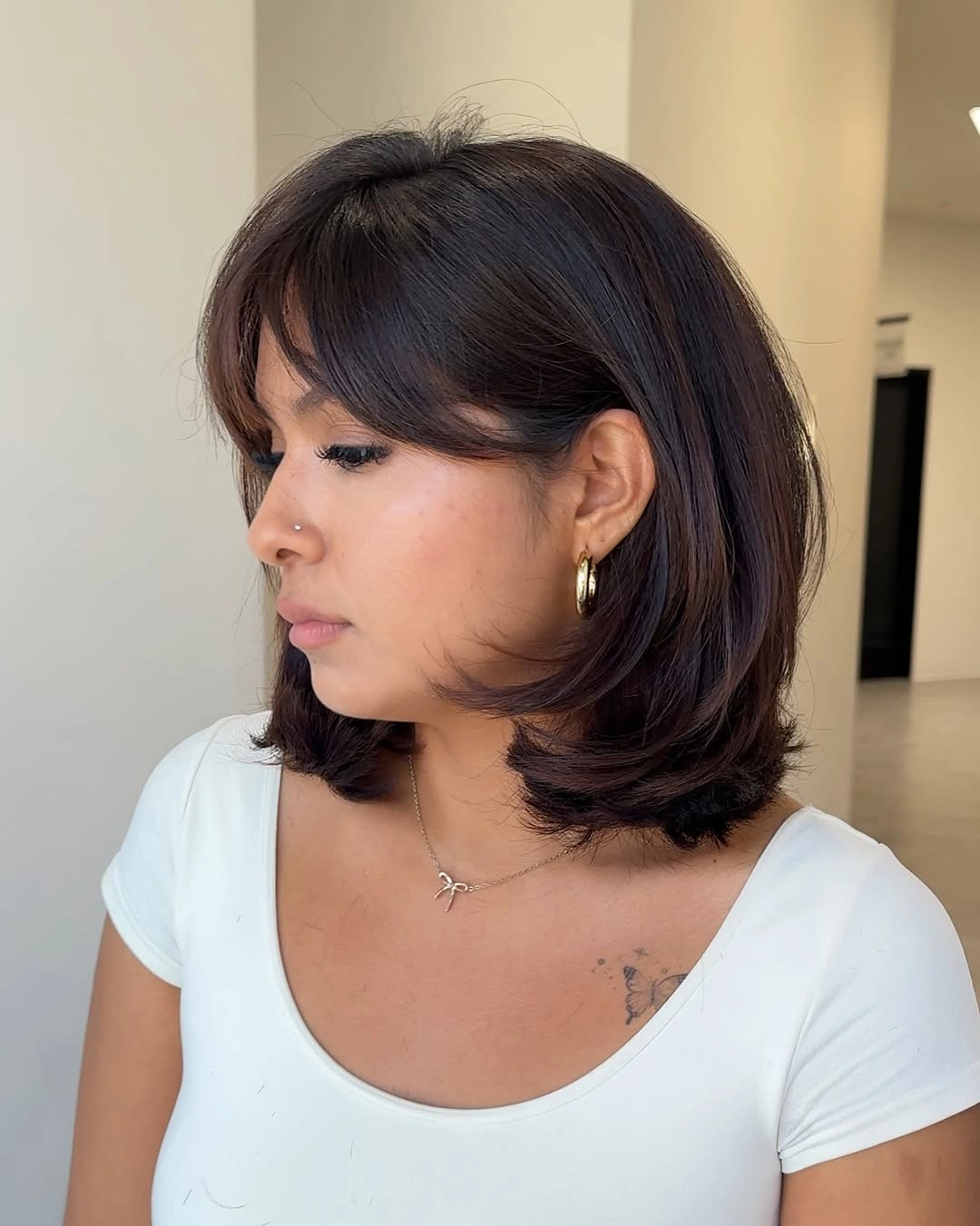 layered bob haircut Shoulder Bob With Rounded Curtain Bangs