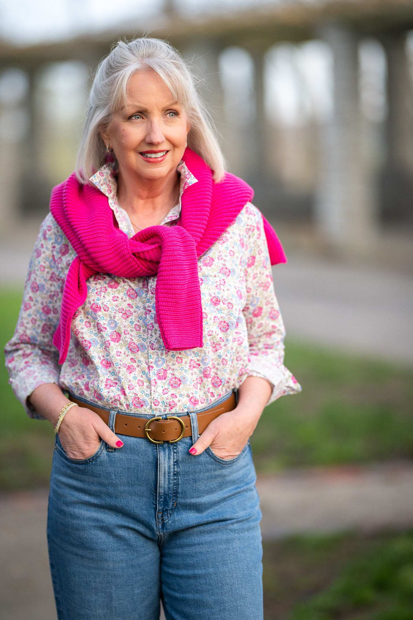 Cozy Knit Sweater Draped Over a Floral Shirt and Jeans — Winter Outfits for Women Over 60