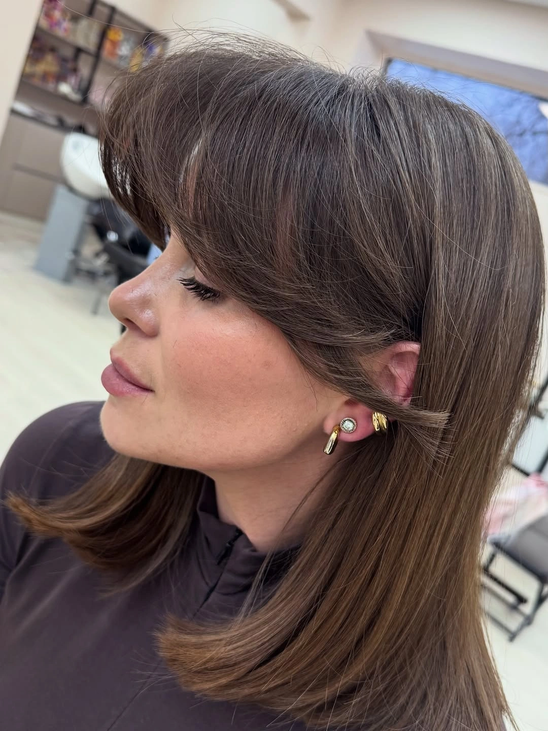 modern haircut for women Glossy Medium Cut With Curtain Layers