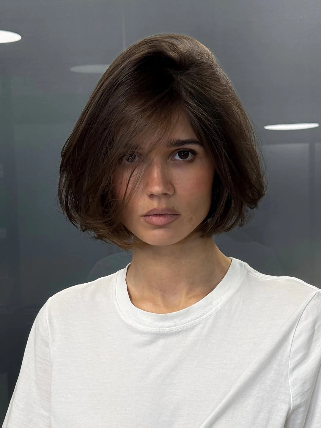 modern haircut for women Rounded Brunette Bob With Side Sweep