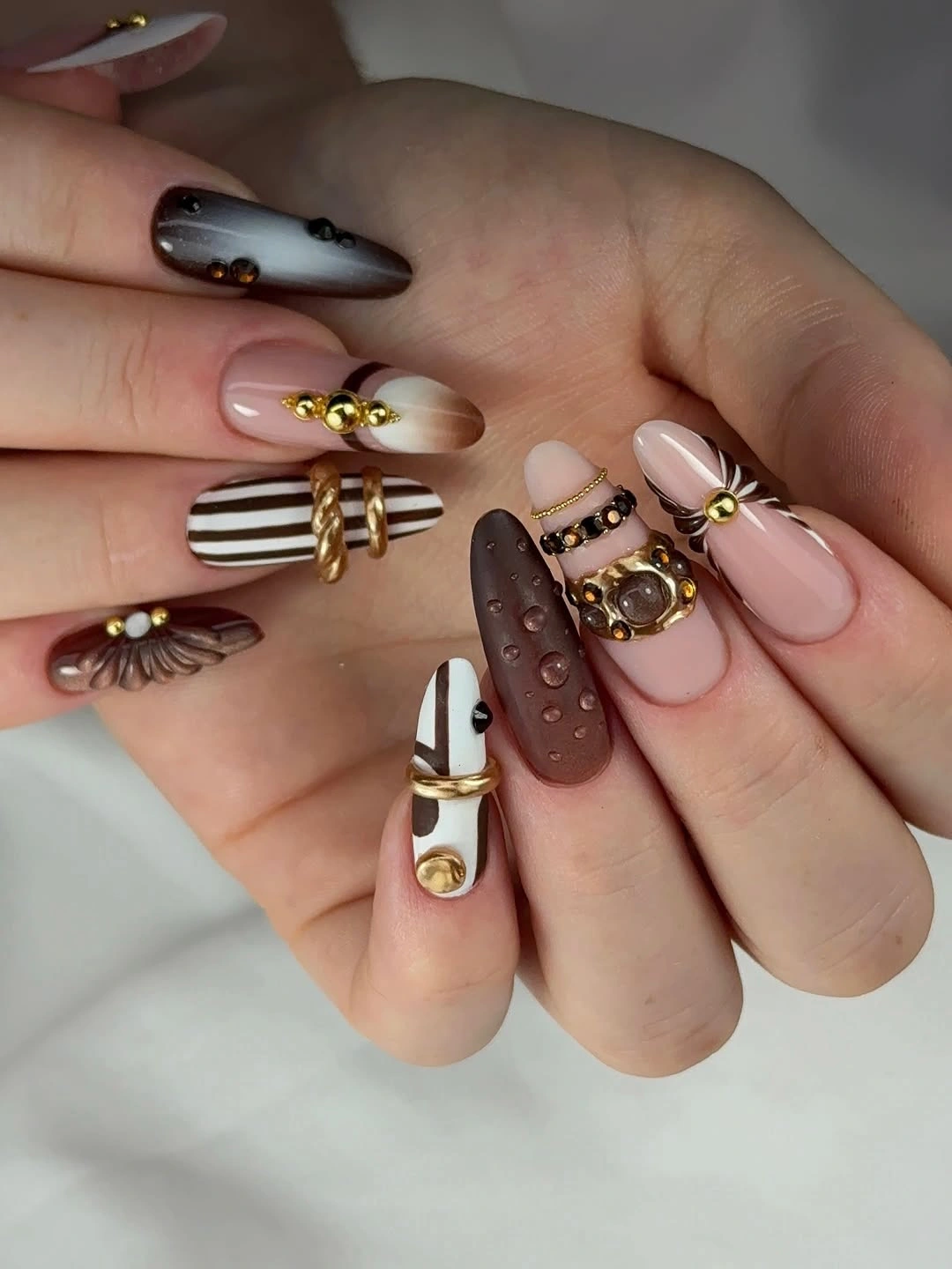 November nails ideas 2026 Brown Gold And Cream Mixed Nail Art