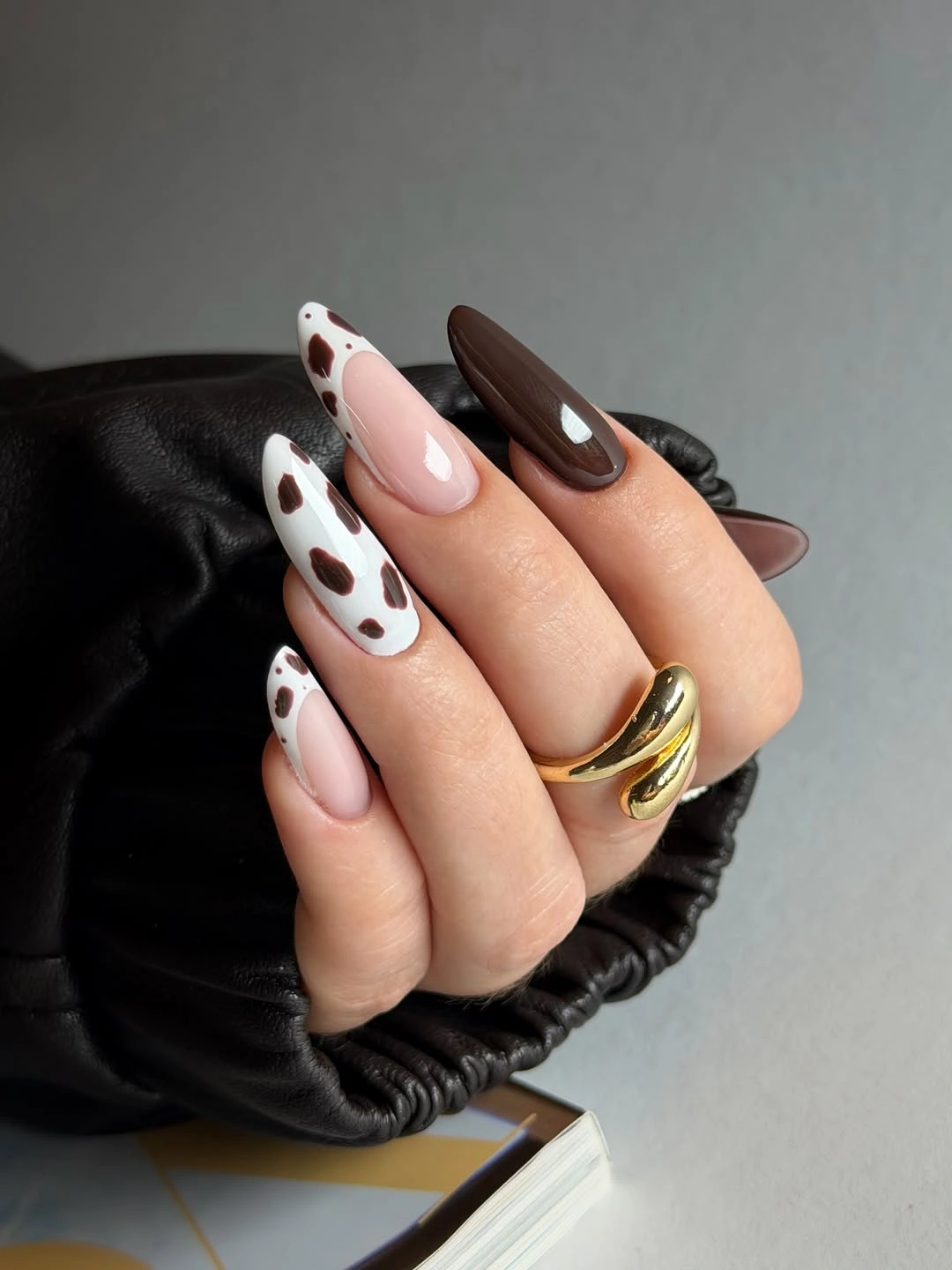 November nails ideas 2026 Chocolate Cow Print Almond Nails
