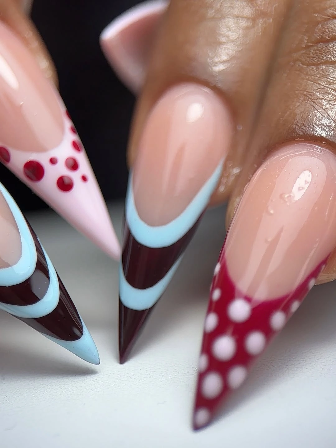 November nails ideas 2026 Burgundy And Icy Blue Graphic French Nails