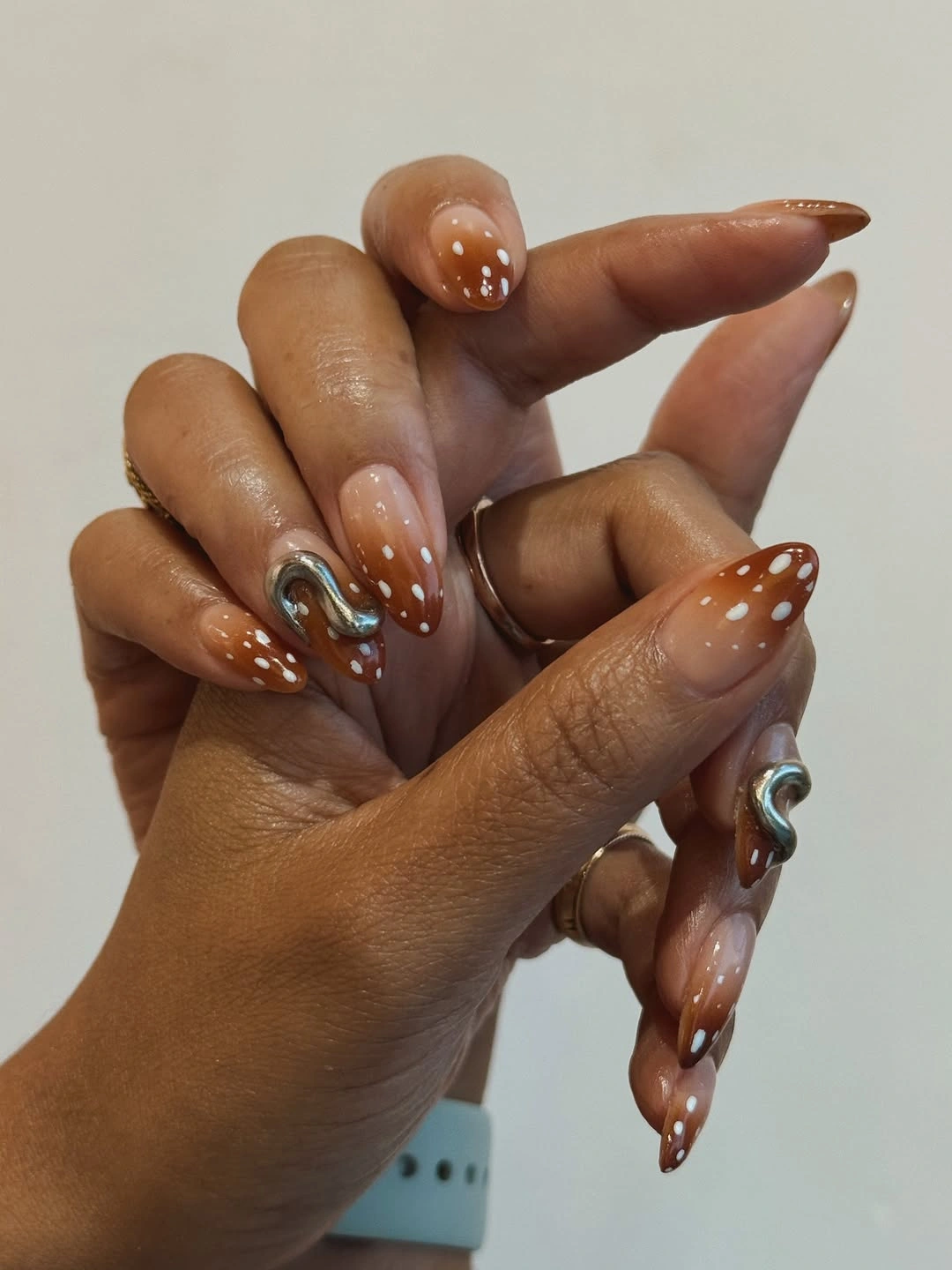 November nails ideas 2026 Caramel Brown Dotted Almond Nails