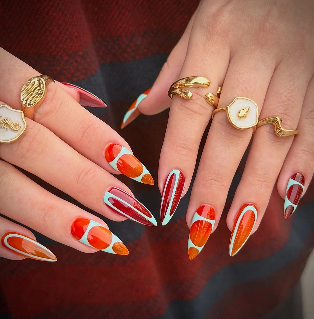 November nails ideas 2026 Bright Orange And Icy Blue Thanksgiving Almonds