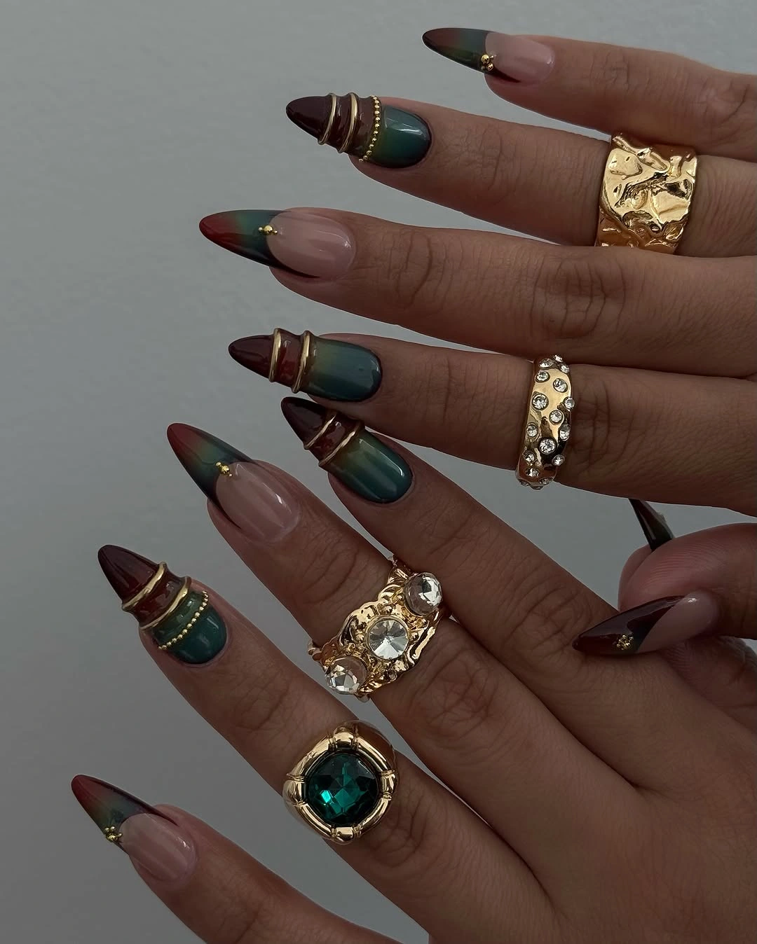 November nails ideas 2026 Deep Green And Burgundy Cat Eye Nails