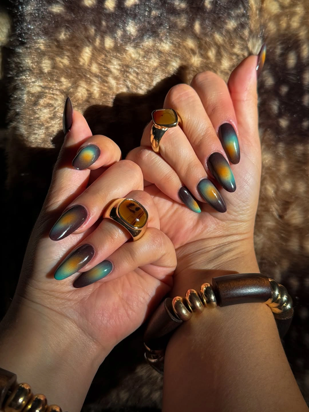 November nails ideas 2026 Moody Blue Green And Amber Cat Eye Nails