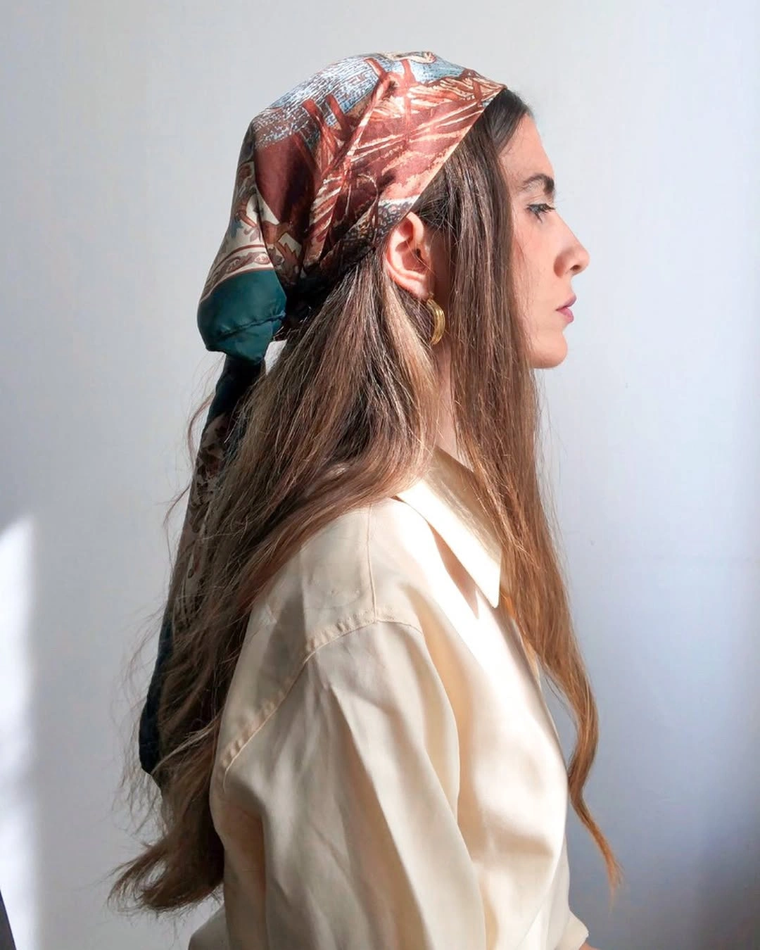 scarf hairstyle for women Long Hair With an Italian-Inspired Scarf