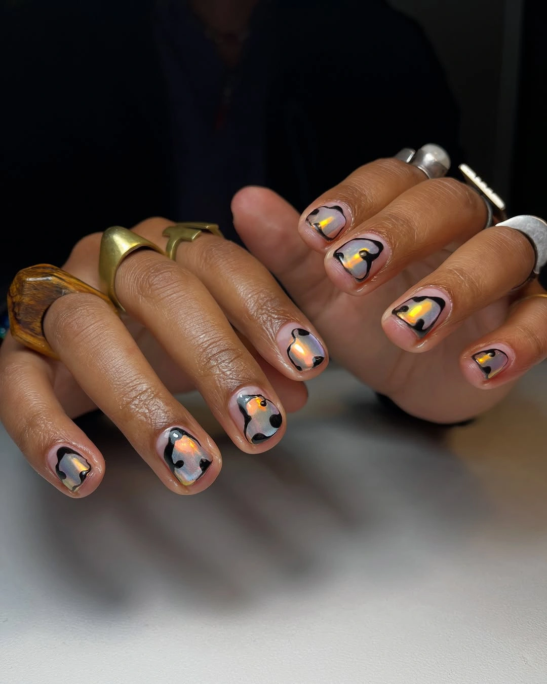 Short nails 2027 Opal Glow With Black And Gold Details