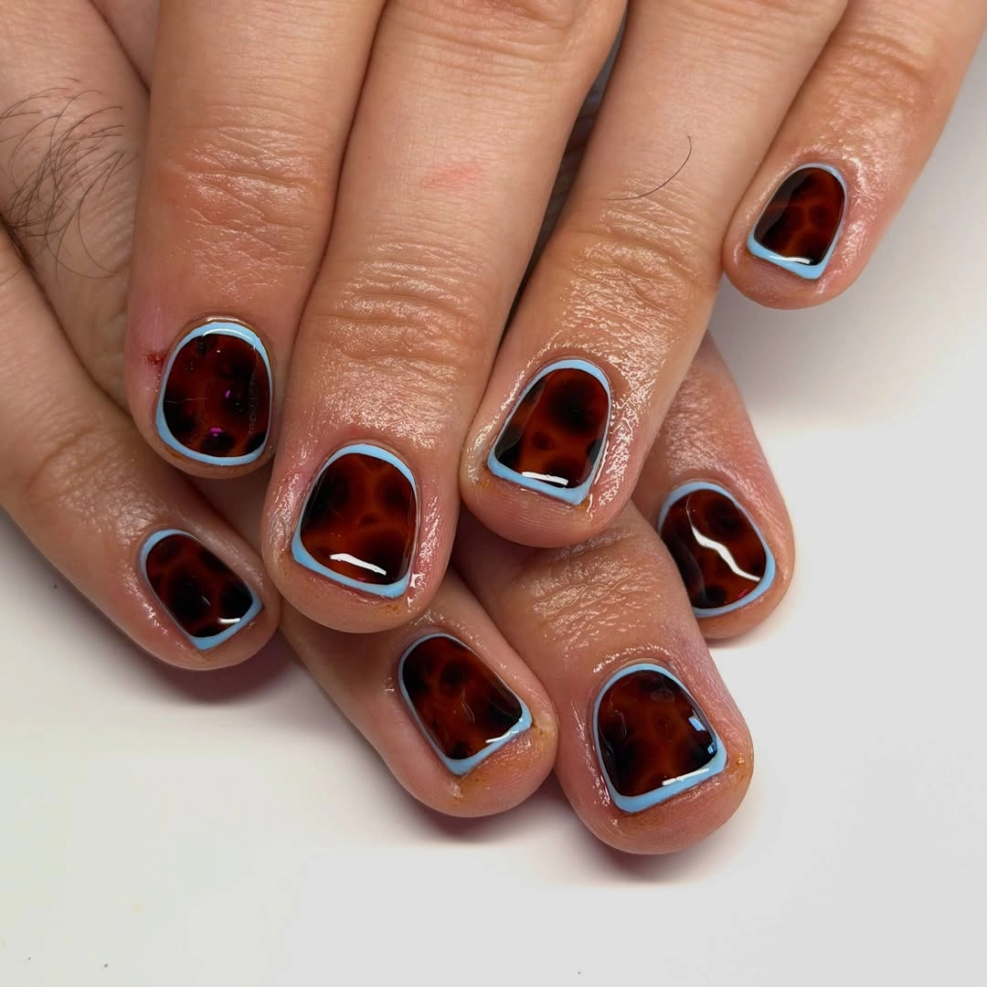 Short nails 2027 Tortoiseshell Short Nails With Blue Outline