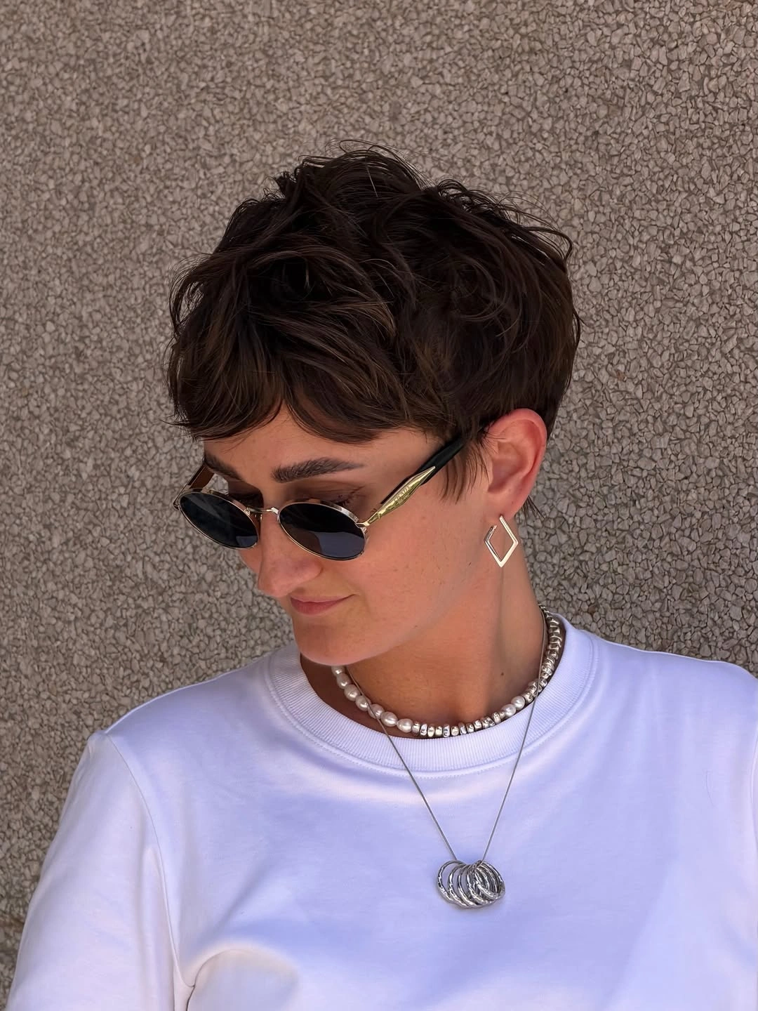 short pixie cuts for women Wavy Brunette Pixie With Statement Accessories