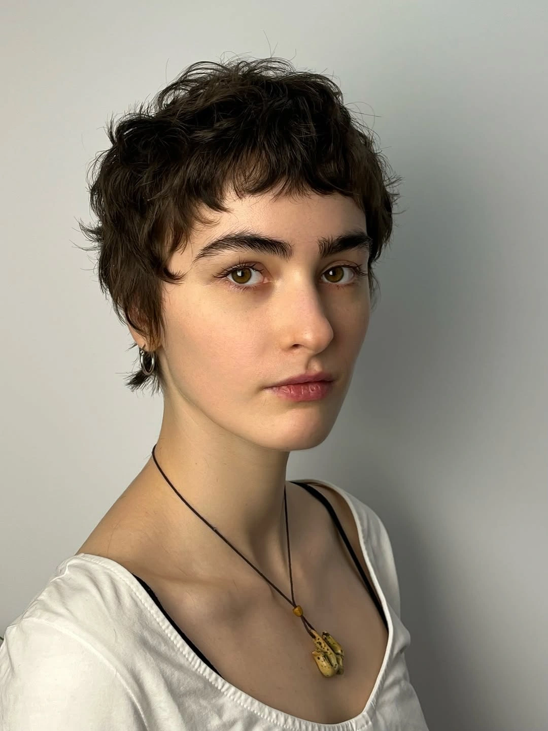 short pixie cuts for women Soft Curly Pixie With Wispy Bangs