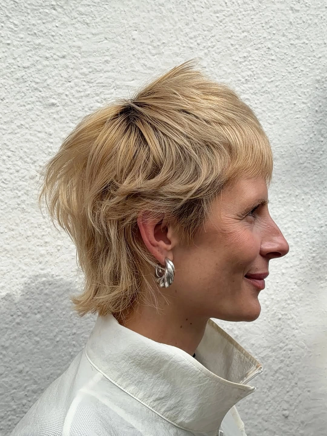 short pixie cuts for women Blonde Layered Pixie With a Grown-Out Feel