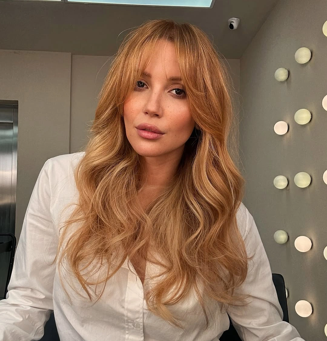 strawberry blond hair color Classic Strawberry Blond With Curtain Bangs