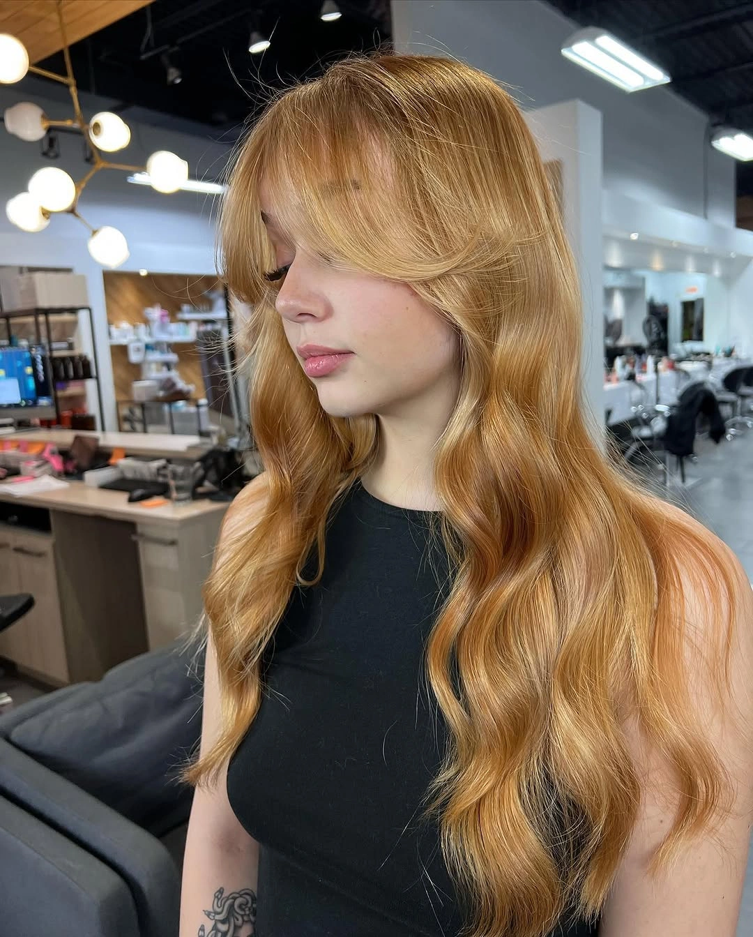 strawberry blond hair color Golden Strawberry Blond With Curtain Bangs