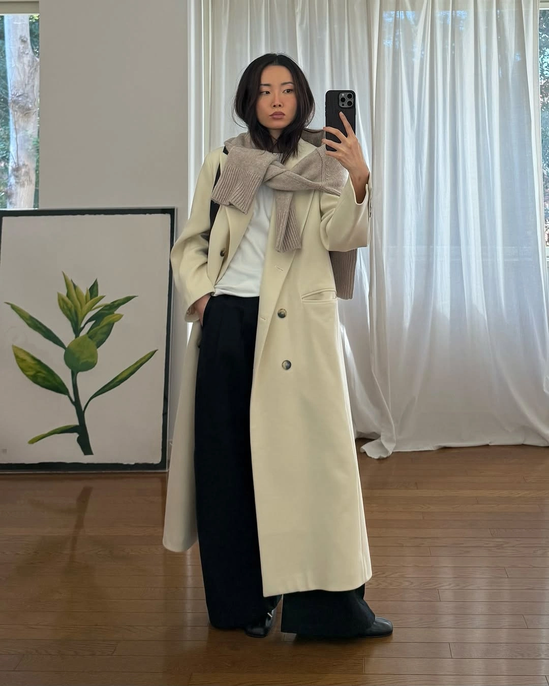 trendy coats 2027 - Long cream coat with wide-leg trousers