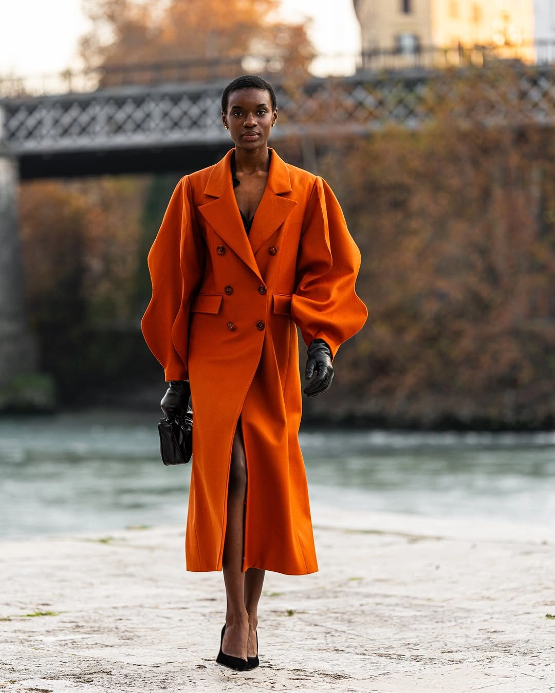 trendy coats 2027 - Orange tailored coat with black accessories
