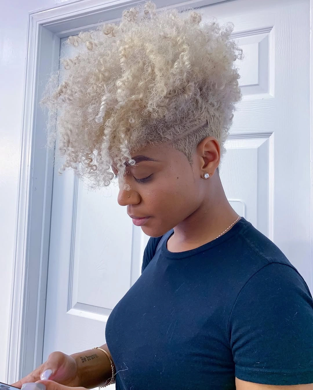 trendy haircuts for black women 2027 Platinum Curly Crop With A Tapered Side