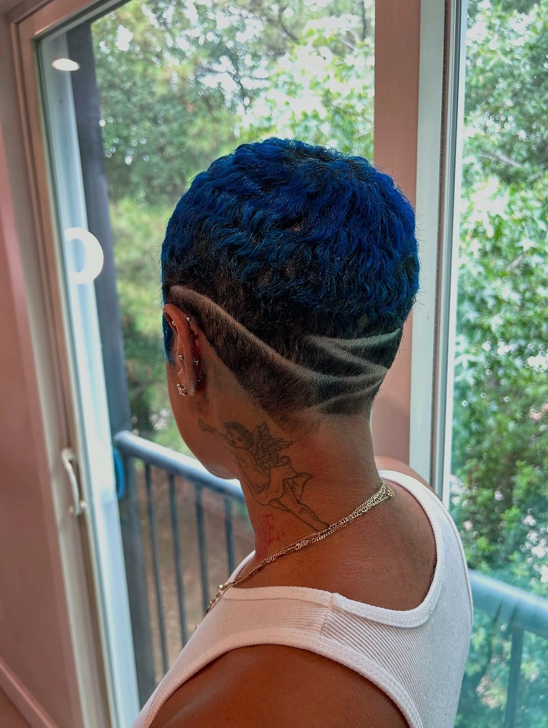 trendy haircuts for black women 2027 Electric Blue Curly Undercut