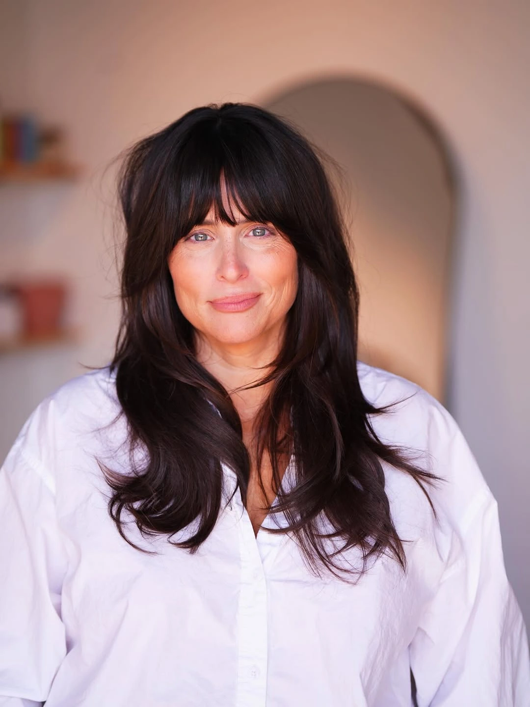 trendy haircuts for women over 40 2027 Glossy Butterfly Layers with Soft Bangs