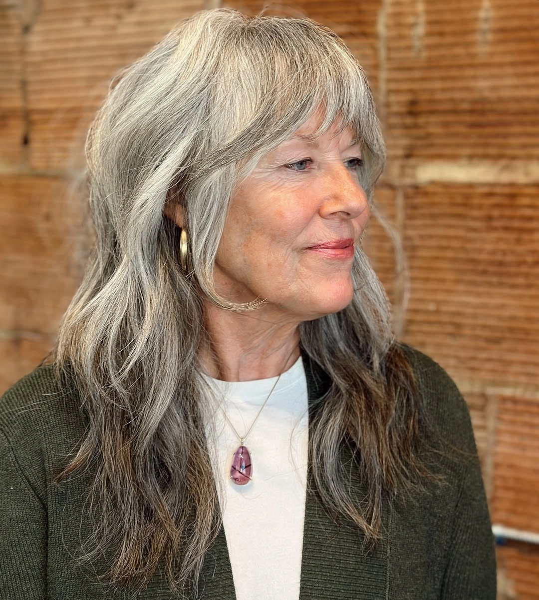 trendy haircuts for women over 50 2027 Long Silver Layers with Wispy Bangs