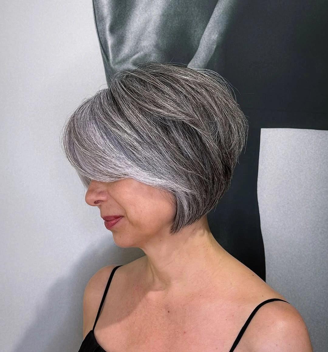 trendy haircuts for women over 50 2027 Voluminous Silver Layered Bob