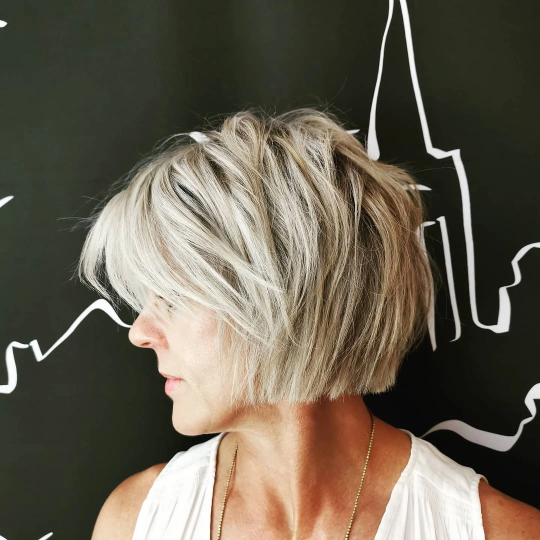 trendy haircuts for women over 50 2027 Choppy Blonde Graduated Bob
