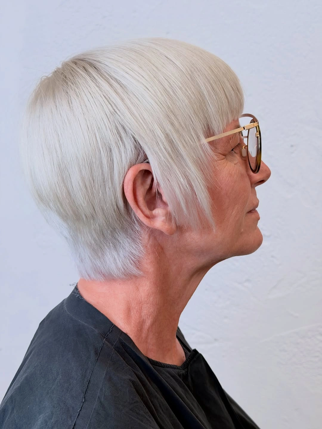 trendy haircuts for women over 50 2027 Sleek Platinum Bixie
