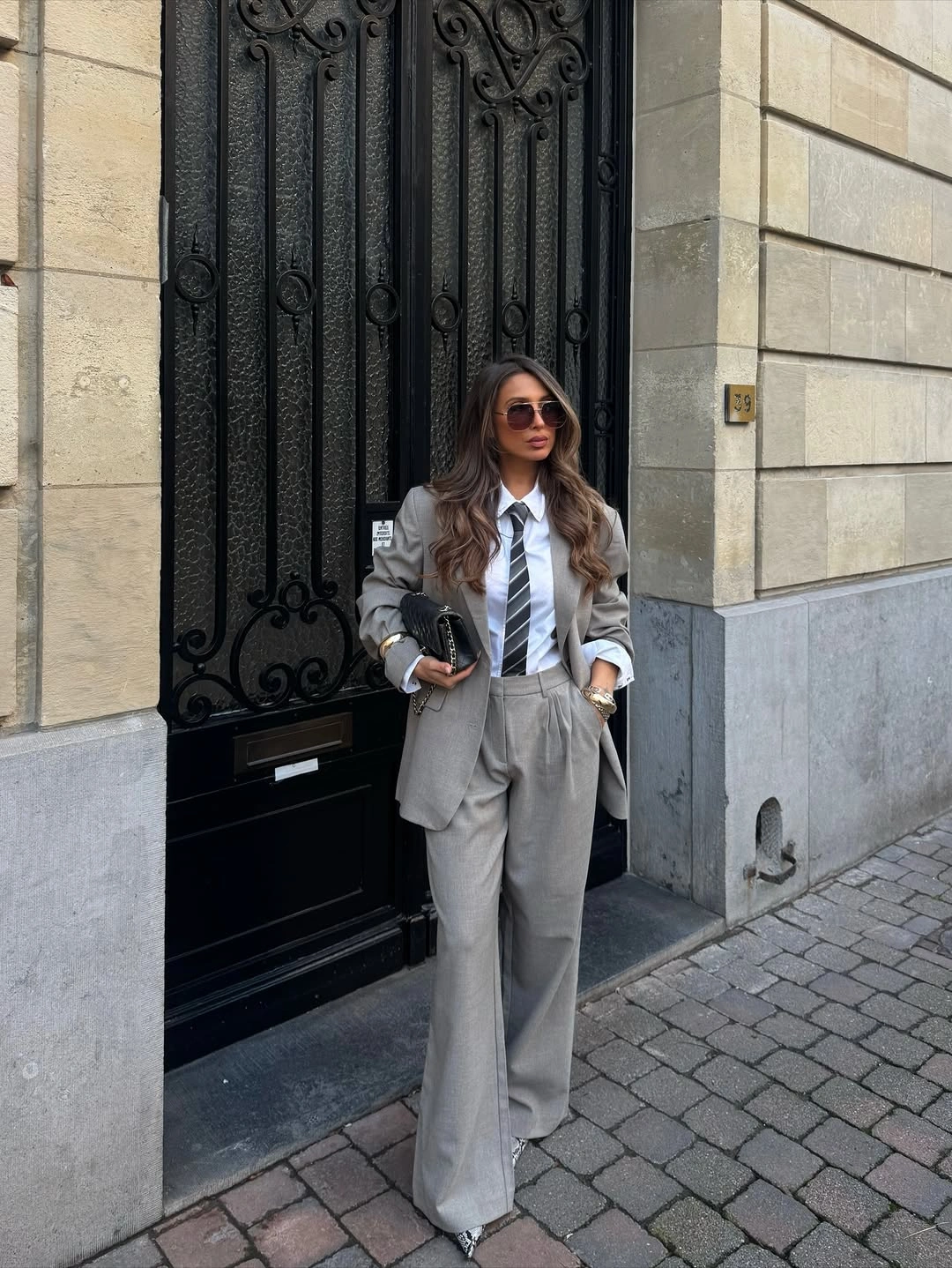 trendy winter business casual outfits Soft Grey Suit With a Striped Tie