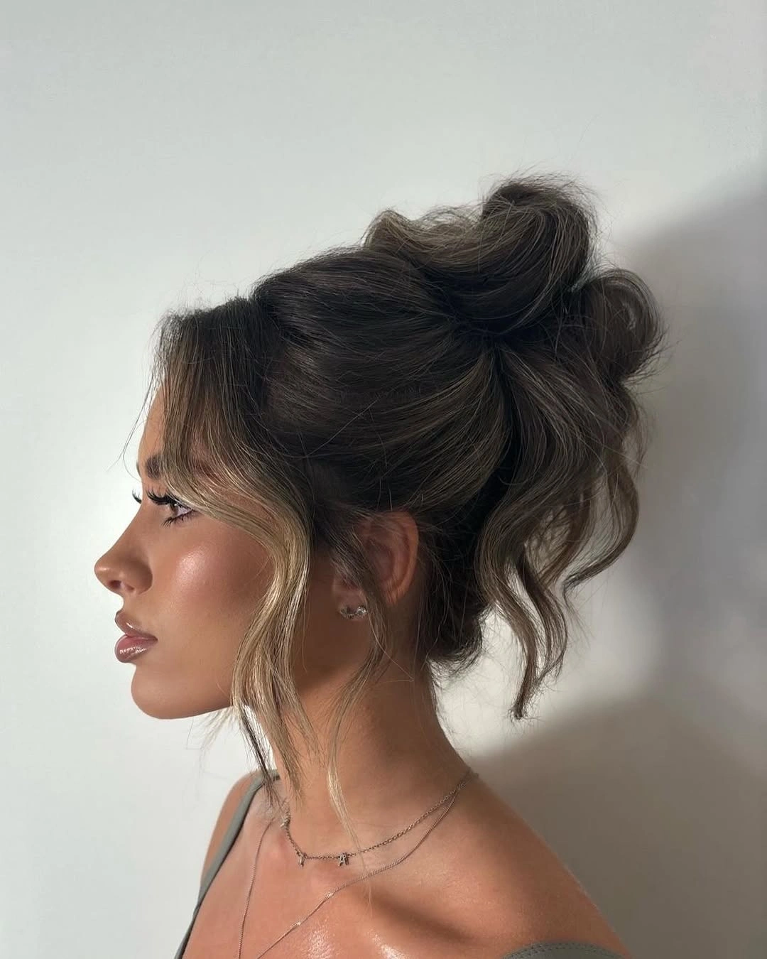 up hairstyles for women Voluminous Brunette Updo with Blonde Tendrils