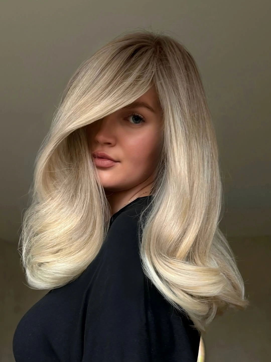 winter blonde hair color ideas Icy Blonde With Sweeping Side Layers
