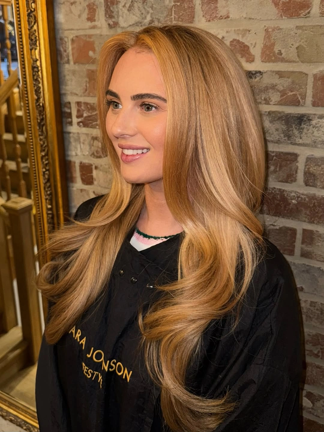 winter blonde hair color ideas Warm Caramel Blonde With Glossy Waves