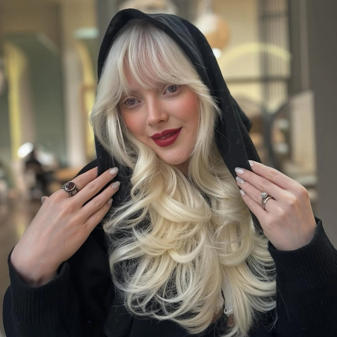 winter haircuts Icy Blonde Layers With Feathered Bangs