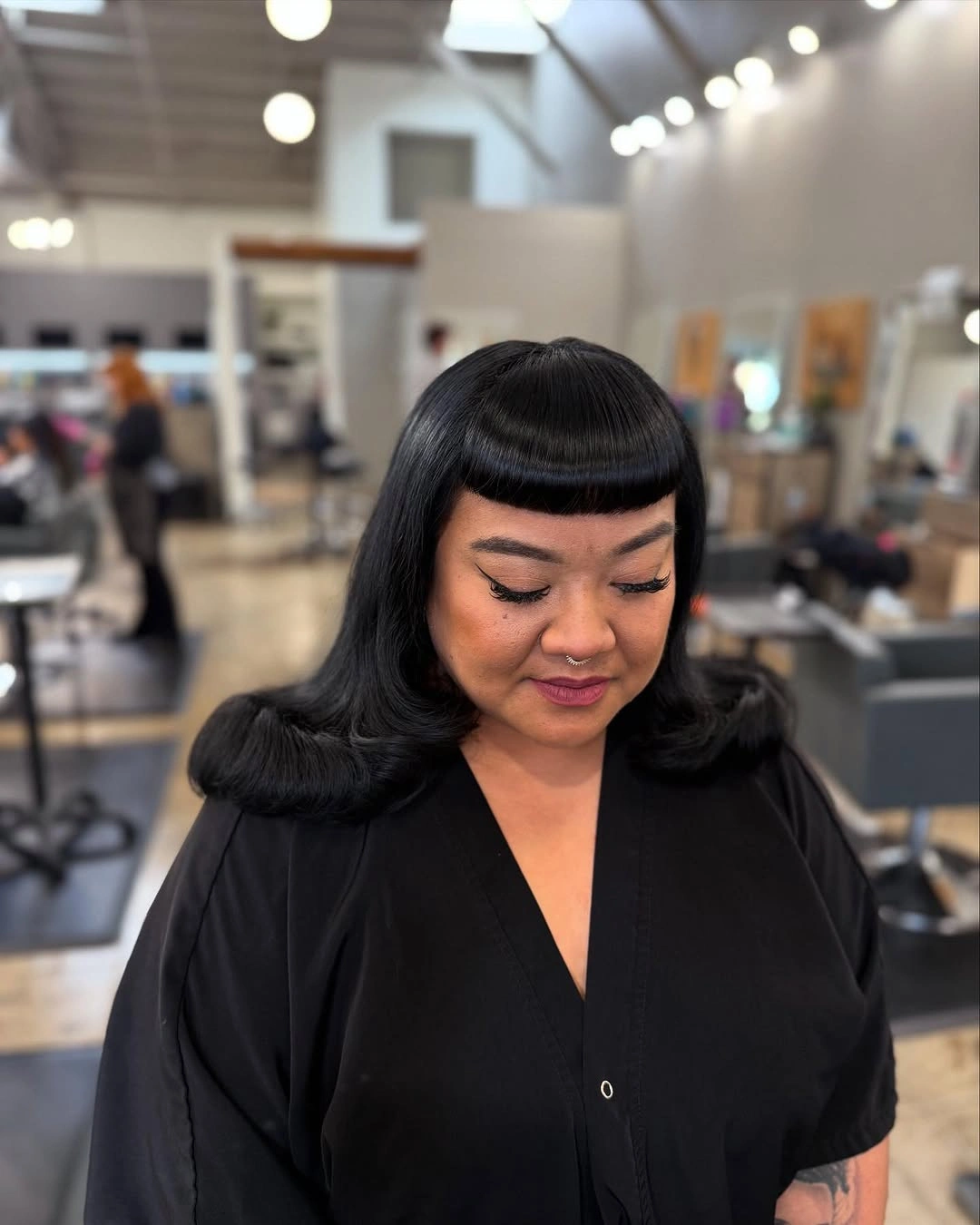 winter haircuts for plus size women Glossy Rounded Bob With Full Fringe