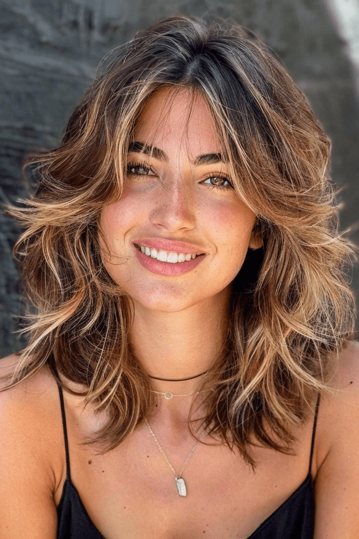Shoulder-Length Shag With Wispy Bangs Shoulder-Length Shag With Wispy Bangs — Winter Haircuts for Wavy Hair