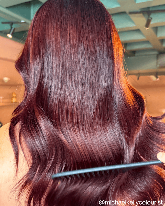 Vibrant Cherry Vinyl Red Bob — Winter Hair Colors for Plus Size Women