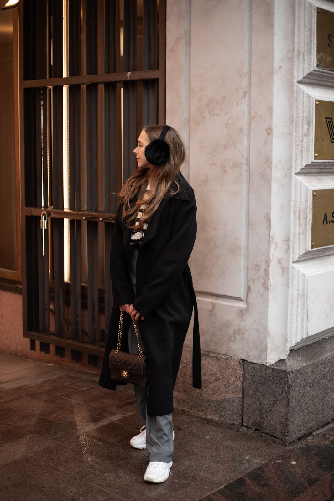 Urban Edge: Black Coat, Striped Top, and Fluffy Earmuffs — Earmuffs Outfits