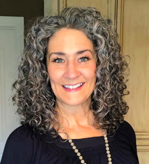 Voluminous Gray Curls Middle Part Voluminous Gray Curls Middle Part — Winter Haircuts for Gray Hair