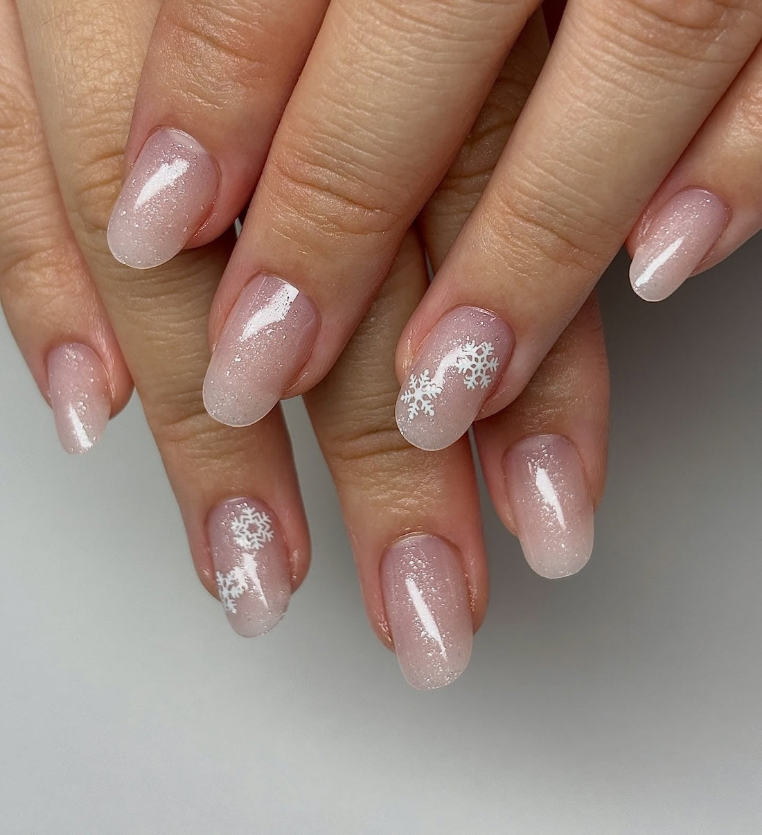 Short Milky Pink Nails with Snowflakes Short Milky Pink Nails with Snowflakes — Winter Gel Nails