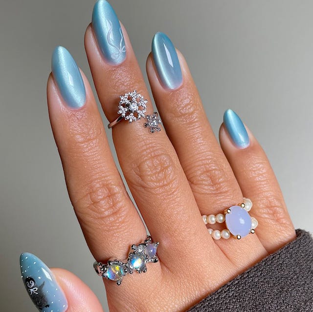 Pale Blue Cat-Eye Snowflake Medium Almond Pale Blue Cat-Eye Snowflake Medium Almond — Winter Nail Colors for Women Over 50