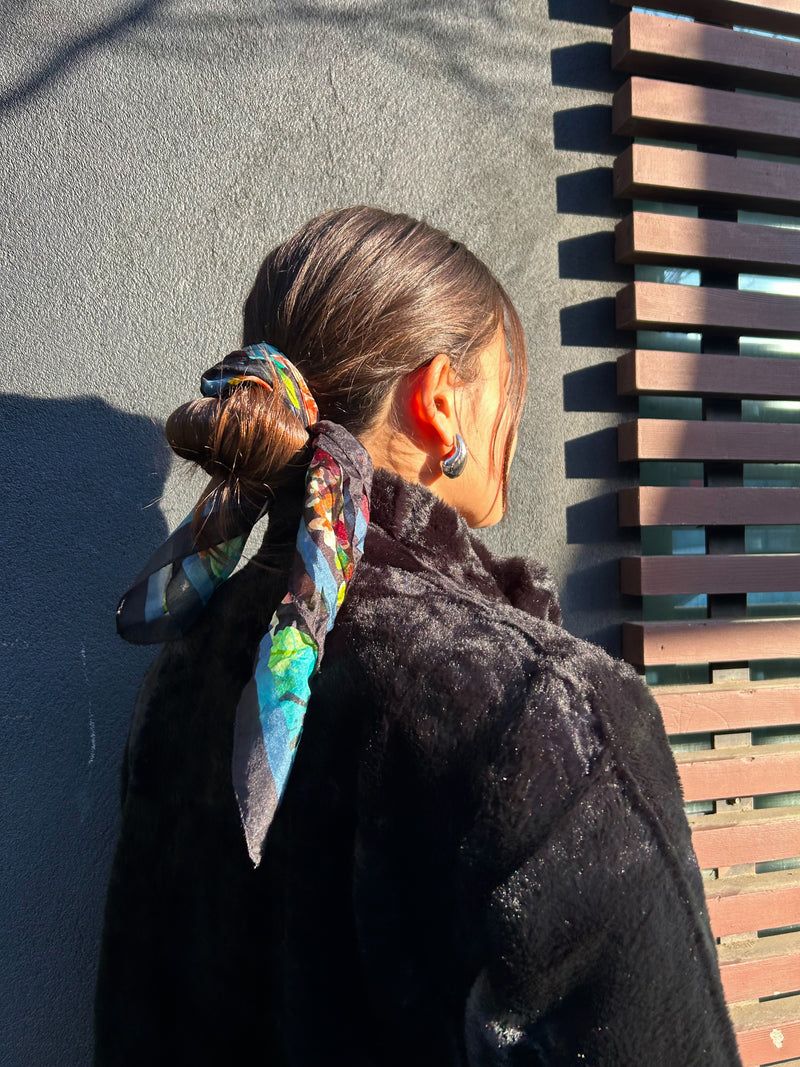 Dark Brown Low Bun with Colorful Scarf Dark Brown Low Bun with Colorful Scarf — Winter Hairstyles with Scarf