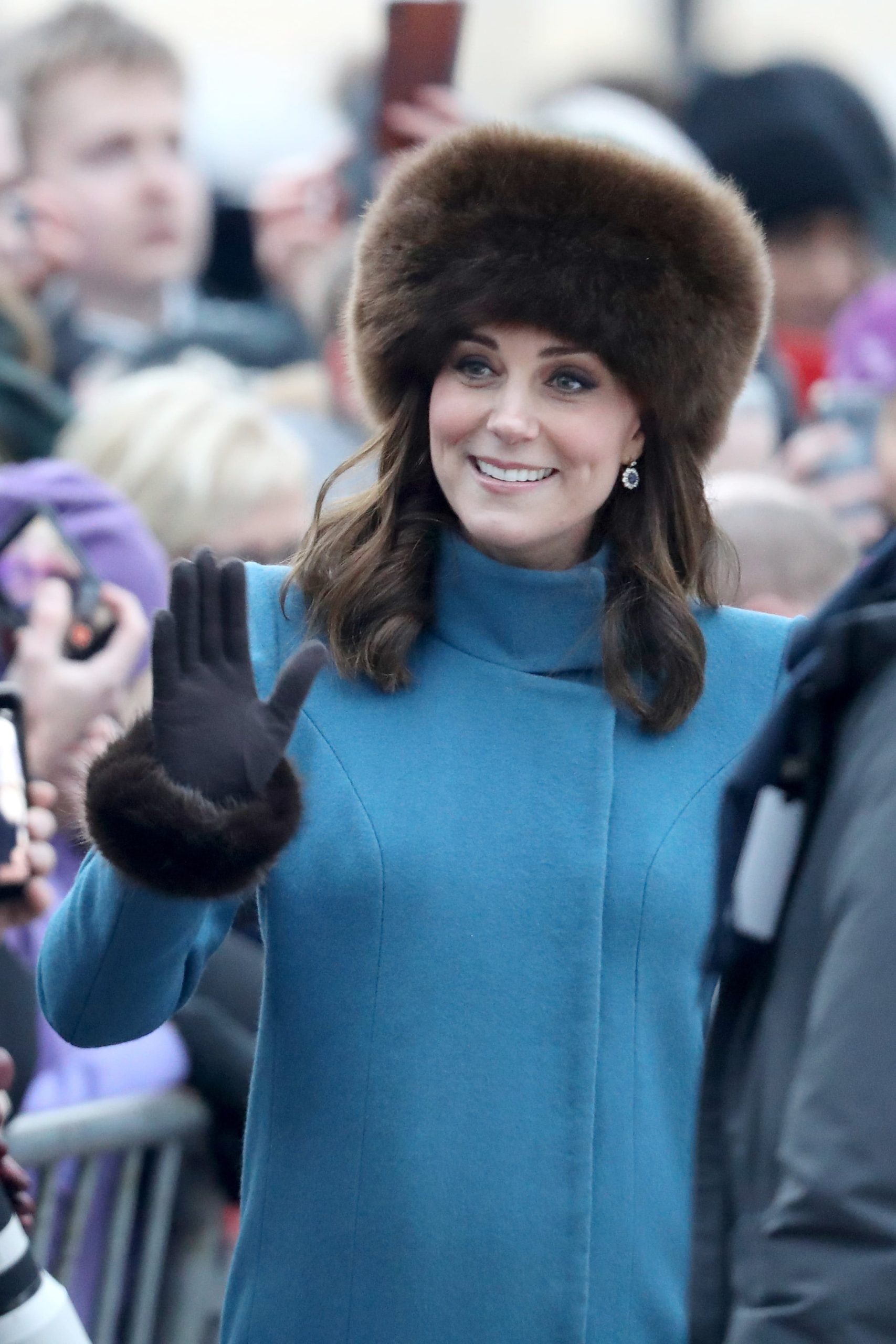 Regal Warmth: Blue Coat and Brown Fur Hat Combination — Fur Hat Outfits