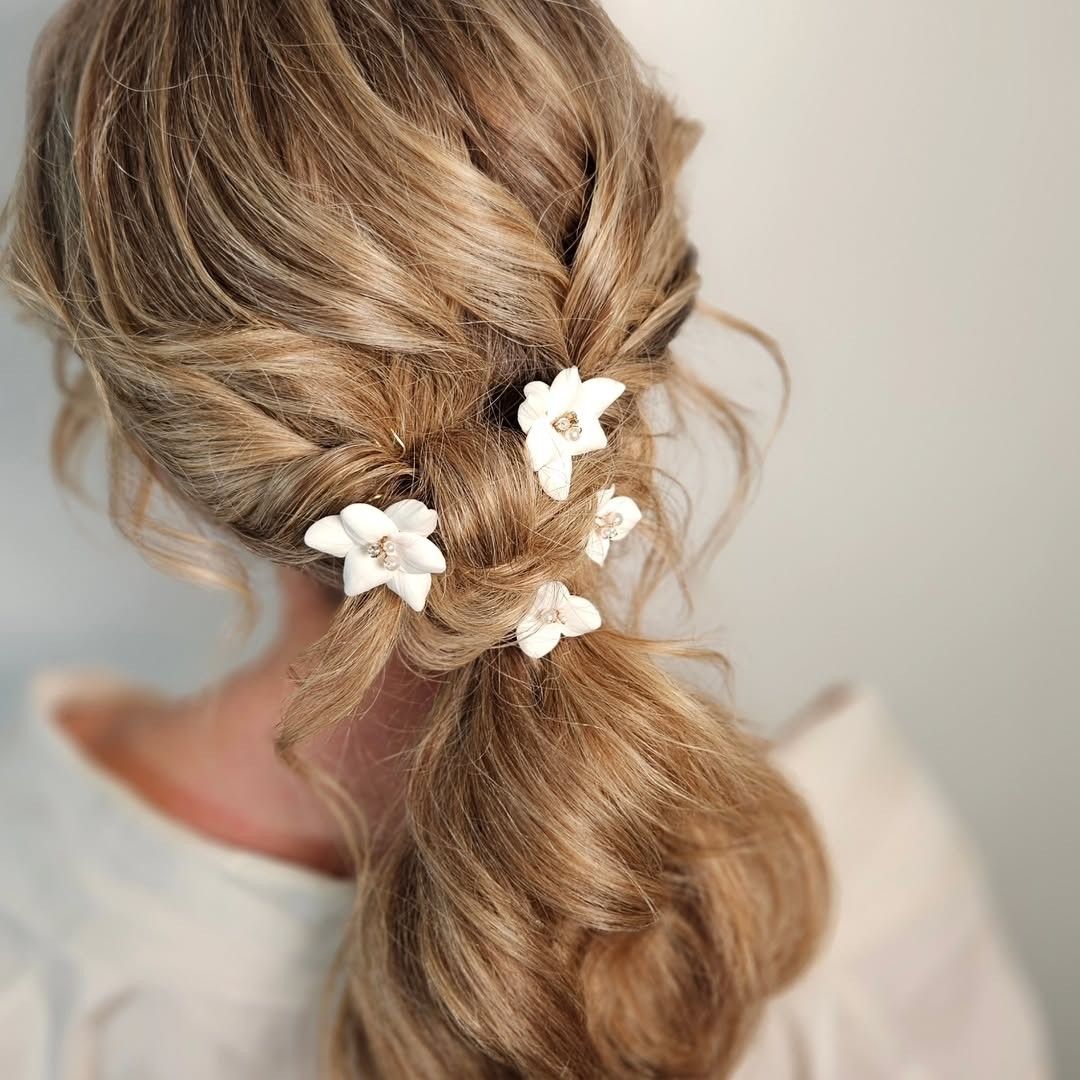 Low Ponytail With Braided Accents Low Ponytail With Braided Accents — Winter Wedding Hairstyles