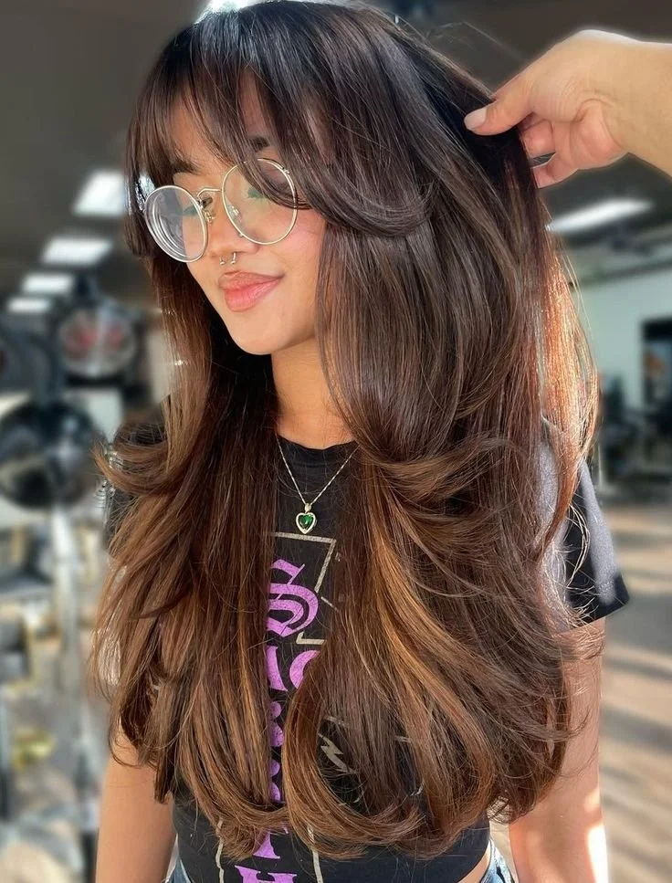 Thick Dark Brown With Wispy Bangs — Long Winter Haircuts