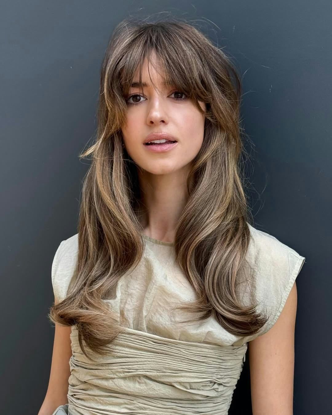 Voluminous Waves With Wispy Bangs — Winter Haircuts for Long Faces